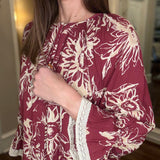 FLORAL PRINTED BLOUSE WITH FLUTTER HEM 12.23